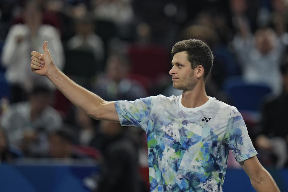 Hubert Hurkacz of Poland reacts to his team members after defeating Sebastian Korda of the United States in the men's singles semifinal match of the Shanghai Masters tennis tournament at Qizhong Forest Sports City Tennis Center in Shanghai, China, Saturday, Oct. 14, 2023. (AP Photo/Andy Wong)