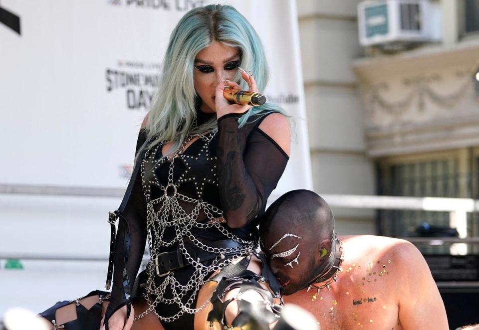 Kesha performs outside the Stonewall Inn during Stonewall Day, the annual New York City event commemorating the anniversary of the Stonewall riots (AFP via Getty Images)