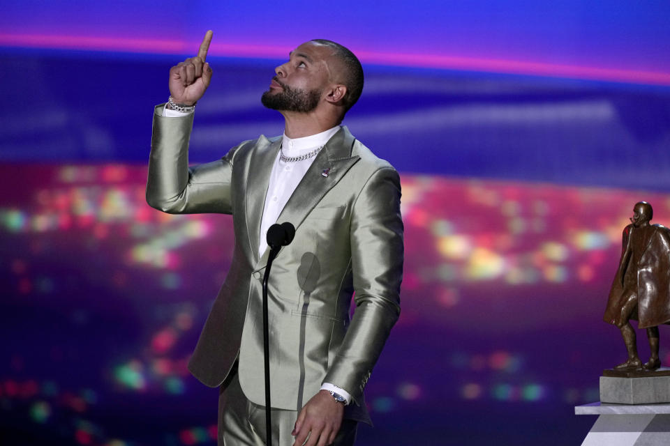 Walter Payton Player of the Year Award winner, Dallas Cowboys' Dak Prescott, gestures during the NFL Honors award show ahead of the Super Bowl 57 football game, Thursday, Feb. 9, 2023, in Phoenix. (AP Photo/David J. Phillip)