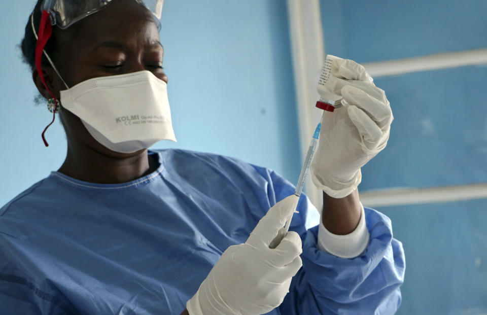 In this Wednesday, May 30, 2018 file photo a healthcare worker from the World Health Organization prepares vaccines to give to front line aid workers, in Mbandaka, Congo. The World Health Organization says Monday, Sept. 23, 2019 Congo will start using a second experimental Ebola vaccine, as efforts to stop the spiraling outbreak are stalled and Doctors Without Borders criticizes vaccination efforts to date. (AP Photo/(AP Photo/Sam Mednick, file)