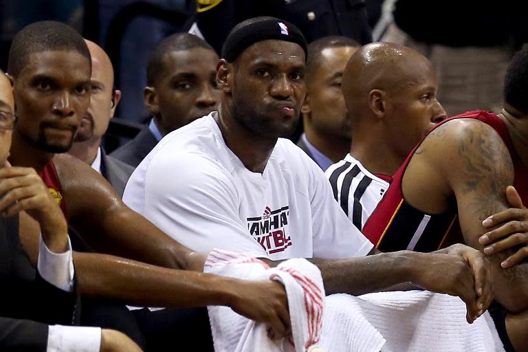 (From L) Chris Bosh and LeBron James of the Miami Heat are seen on the bench during an NBA game at the AT&T Center in San Antonio, Texas, on June 11, 2013