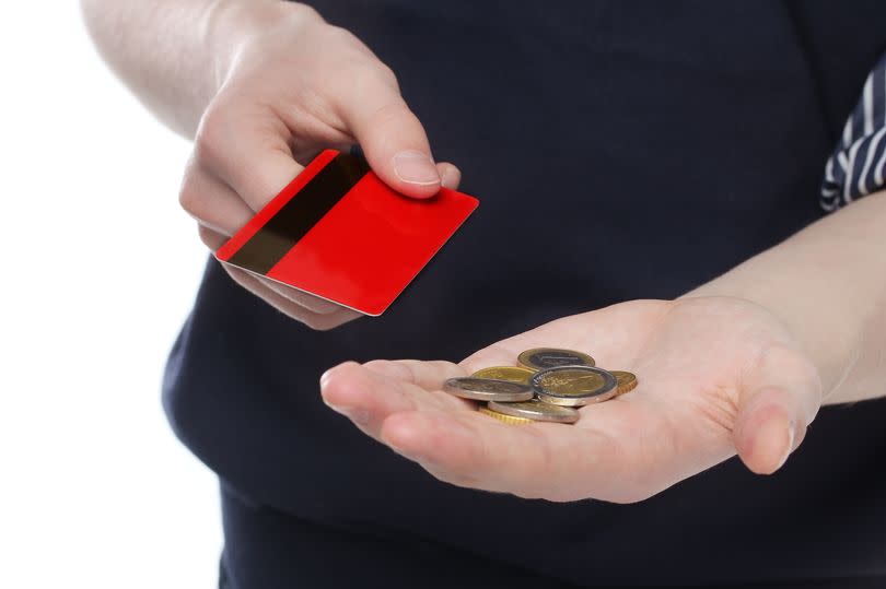 Man holding a money and credit card