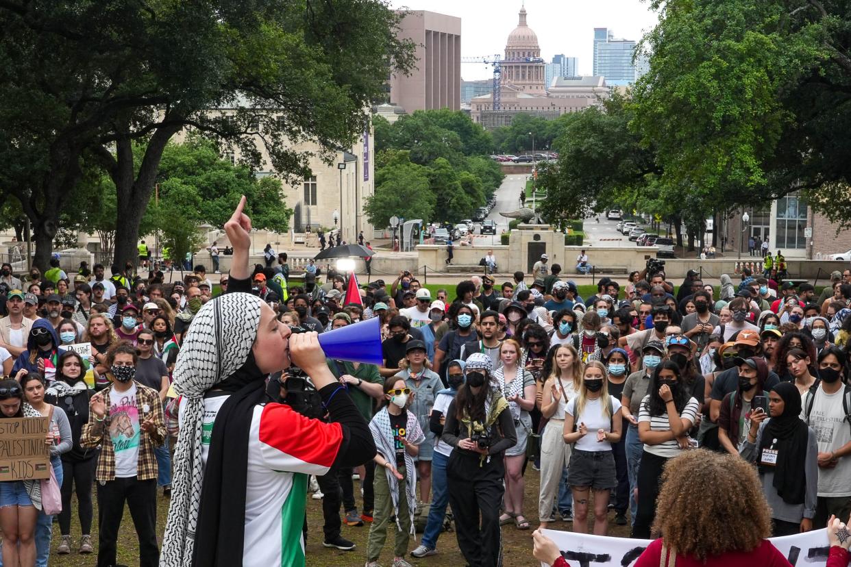 Protester Rawan Channaa leads the crowd in chants at a pro-Palestine protest on the University of Texas Tower south lawn on Sunday, May 5, 2024 in Austin.