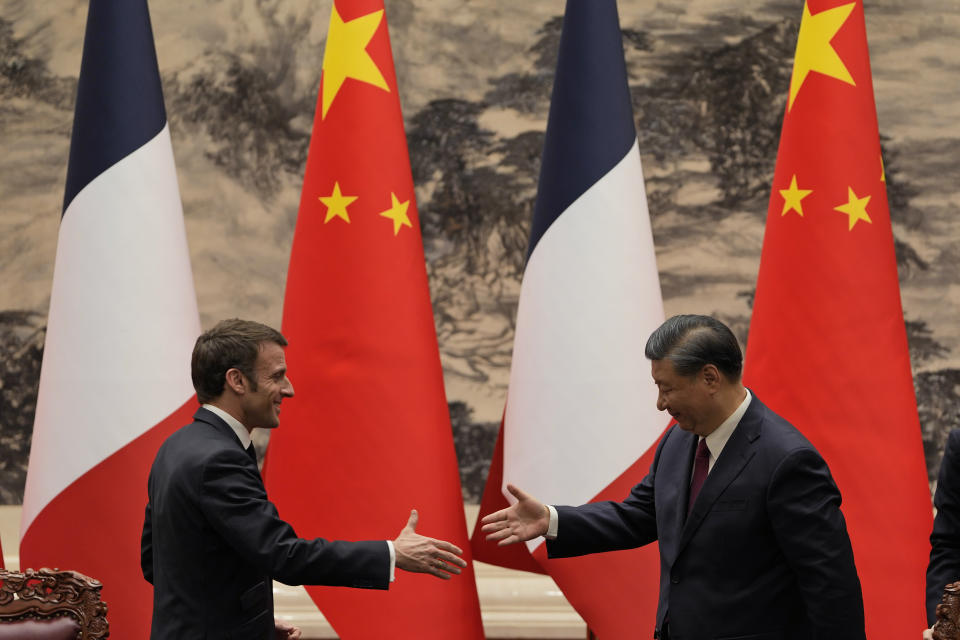 FILE - French President Emmanuel Macron, left, shakes hands with Chinese President Xi Jinping after meeting the press at the Great Hall of the People in Beijing, on April 6, 2023. In the weeks since Chinese leader Xi Jinping won a third five-year term as president, setting him on course to remain in power for life, leaders and diplomats from around the world have beaten a path to his door. None more so than those from Europe. (AP Photo/Ng Han Guan, Pool, File)