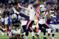 Indianapolis Colts' Matthew Adams, right, blocks a punt by New England Patriots punter Jake Bailey (7) during the first half of an NFL football game Saturday, Dec. 18, 2021, in Indianapolis. The Colts' E.J. Speed ran the ball back for a touchdown. (AP Photo/Aaron Doster)