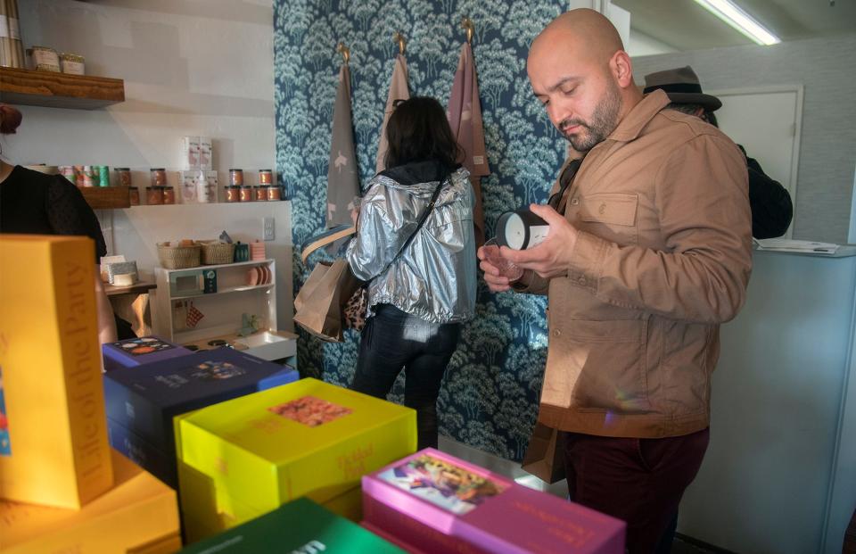 (11/27/21) Marcus Milani shops at the Cena Luna store during the Miracle MIle's Sip and Stroll wine tasting/shopping event in Stockton. CLIFFORD OTO/THE STOCKTON RECORD