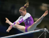 ATHENS - AUGUST 15: Stephanie Moorhouse of Australia competes on the Uneven Bars in the qualification round of the team event at the women's artistic gymnastics competition on August 15, 2004 during the Athens 2004 Summer Olympic Games at the Olympic Sports Complex Indoor Hall in Athens, Greece. (Photo by Clive Brunskill/Getty Images)