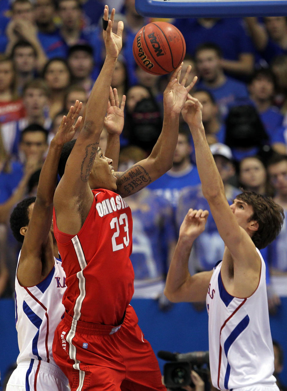 LAWRENCE, KS - DECEMBER 10: Jeff Withey #5 of the Kansas Jayhawks blocks a shot by Amir Williams #23 of the Ohio State Buckeyes during the game on December 10, 2011 at Allen Fieldhouse in Lawrence, Kansas. (Photo by Jamie Squire/Getty Images)
