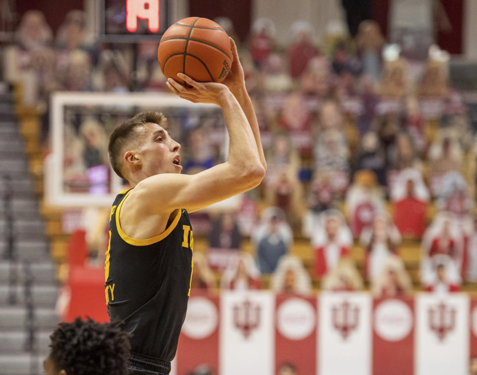 Iowa guard Joe Wieskamp (10) shoots a three-point basket during a NCAA college basketball game against Indiana, Sunday, Feb. 7, 2021, in Bloomington, Ind. Indiana. (AP Photo/Doug McSchooler)