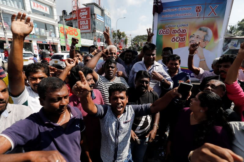 Supporters of Sri Lanka People's Front party presidential election candidate Gotabaya Rajapaksa celebrate after he won the presidential election in Colombo