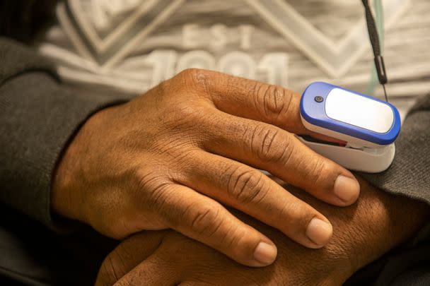 PHOTO: A discharged COVID patient utilizes a pulse oximeter to check their oxygen levels in Los Angeles, Feb. 23, 2021.  (Los Angeles Times via Getty Images, FILE)