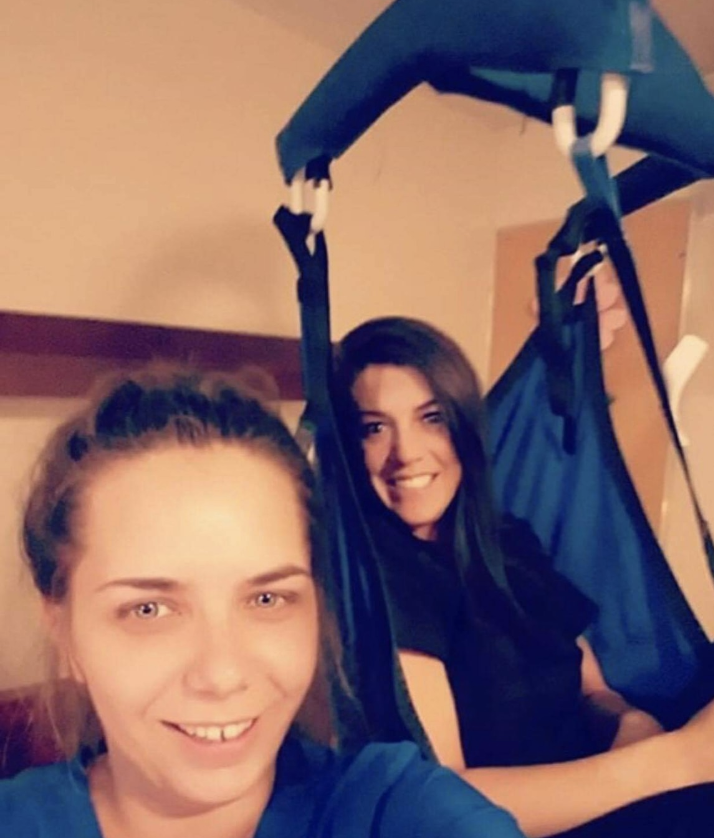 Controversy brews on social media after a woman shared a photo of two nursing home employees making a joke using medical equipment (Credit: Facebook) 