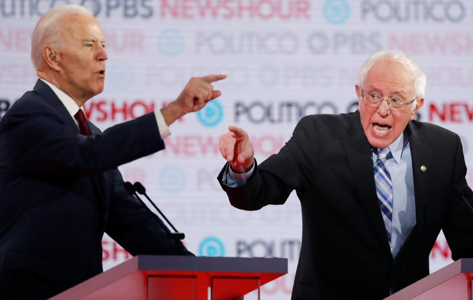 Leading Democratic presidential candidates Joe Biden and Bernie Sanders face off during the Democratic presidential primary debate Dec. 19 in Los Angeles.