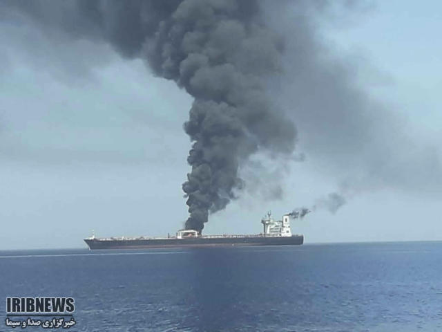In this photo released by state-run IRIB News Agency, an oil tanker is on fire in the sea of Oman, Thursday, June 13, 2019. Two oil tankers near the strategic Strait of Hormuz have been reportedly attacked. The alleged assault on Thursday left one ablaze and adrift as sailors were evacuated from both vessels. The U.S. Navy rushed to assist amid heightened tensions between Washington and Tehran. (IRIB News Agency via AP)