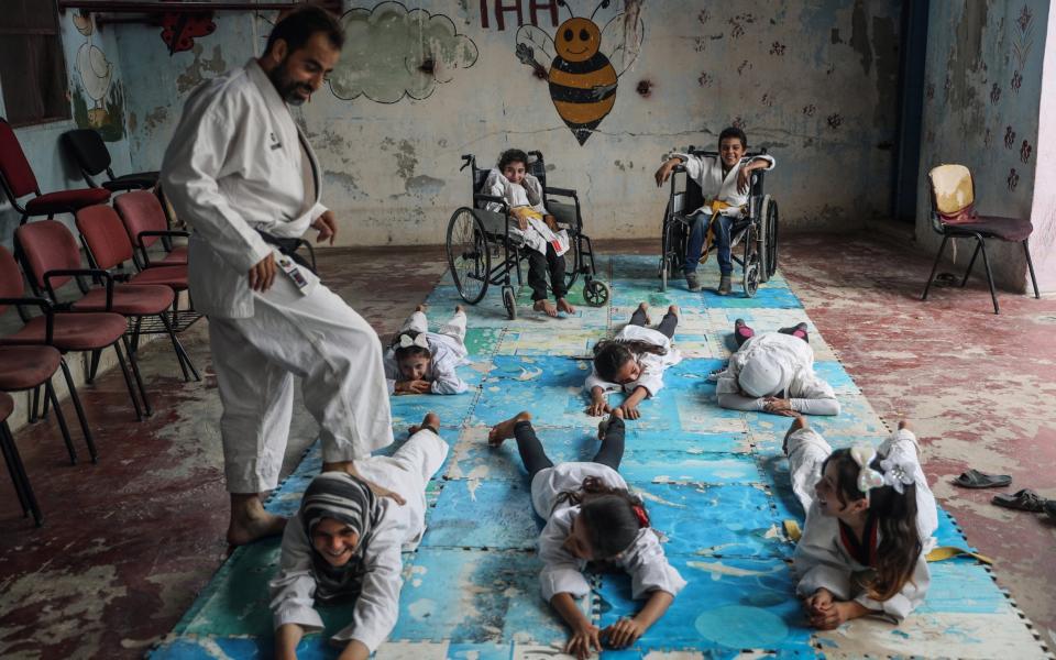 Sport and Fun Instead of War and Fear is a poignant project documenting a village karate school (near the city of Aleppo) which is helping children with and without disabilities overcome the traumas of war. - Anas Alkharboutli/Sony World Photography Awards