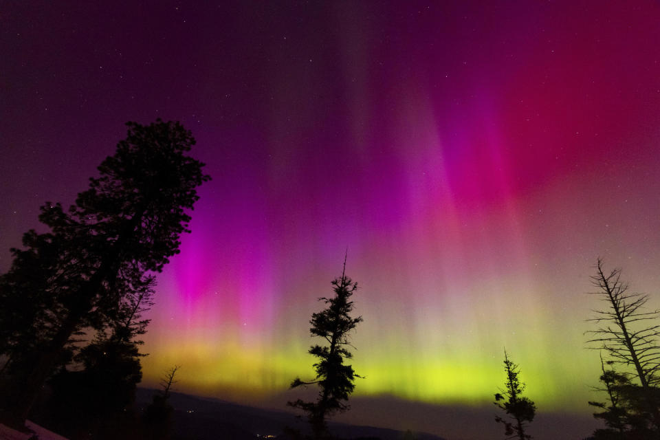 The Northern lights fill the sky at the Bogus Basin ski resort on Saturday, May 11, 2024, in Boise, Idaho. / Credit: Kyle Green / AP