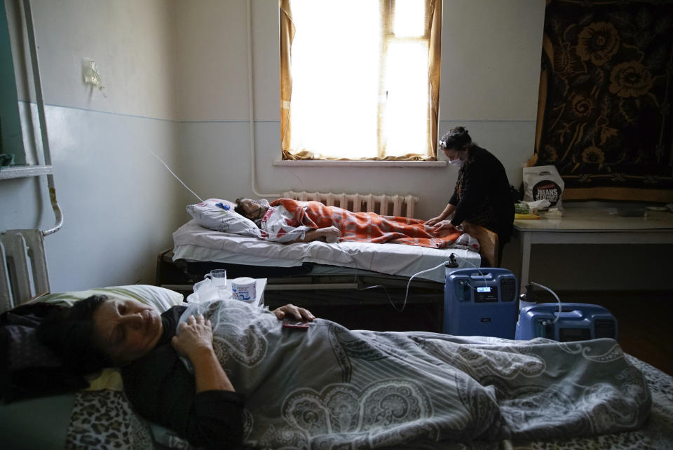 Coronavirus patients lie in an infectious diseases clinic in Stepanakert, in the separatist region of Nagorno-Karabakh, Tuesday, Oct. 20, 2020.Nagorno-Karabakh, which lies within Azerbaijan but has been under the control of ethnic Armenian forces since a war there ended in 1994, faces an outbreak of the coronavirus amid the largest outbreak of hostilities in more than a quarter-century. (AP Photo)