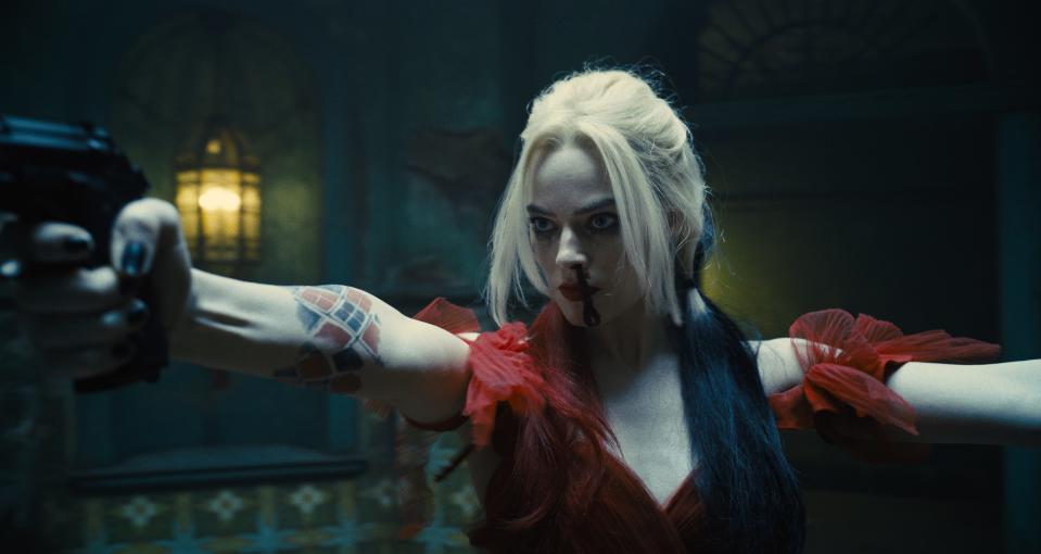 Harley Quinn (Margot Robbie) goes guns-a-blazing again in "The Suicide Squad."