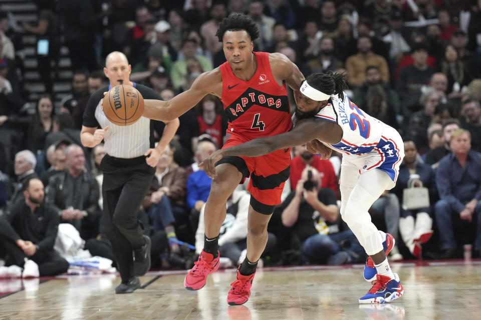 Toronto Raptors' Scottie Barnes drives past Philadelphia 76ers' Patrick Beverley during the first half of an NBA basketball game Saturday, Oct. 28, 2023, in Toronto. (Chris Young/The Canadian Press via AP)