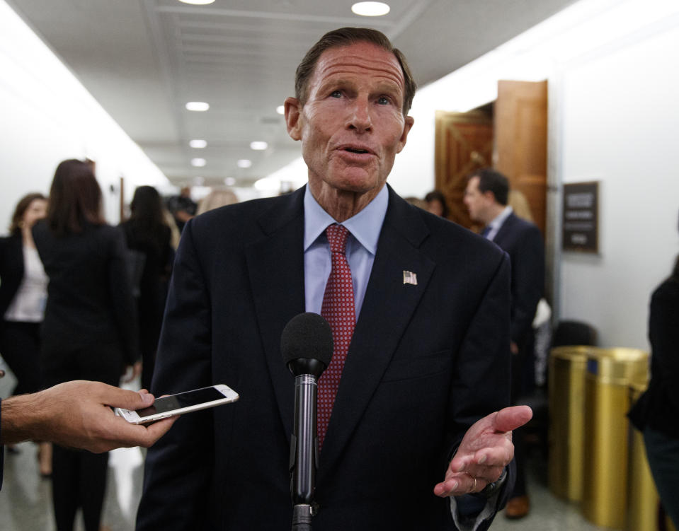 Sen. Richard Blumenthal, D-Conn., speaks to media during a break in a Senate Judiciary Committee hearing on Capitol Hill in Washington, Thursday, Sept. 27, 2018, with Christine Blasey Ford and Supreme Court nominee Brett Kavanaugh. (AP Photo/Carolyn Kaster)