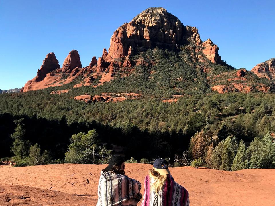 the writer and her friend in arizona on red rocks