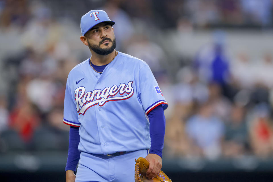 Texas Rangers starting pitcher Martín Pérez walks off the mound after the third inning of a baseball game against the Cleveland Guardians, Sunday, July 16, 2023, in Arlington, Texas. (AP Photo/Gareth Patterson)