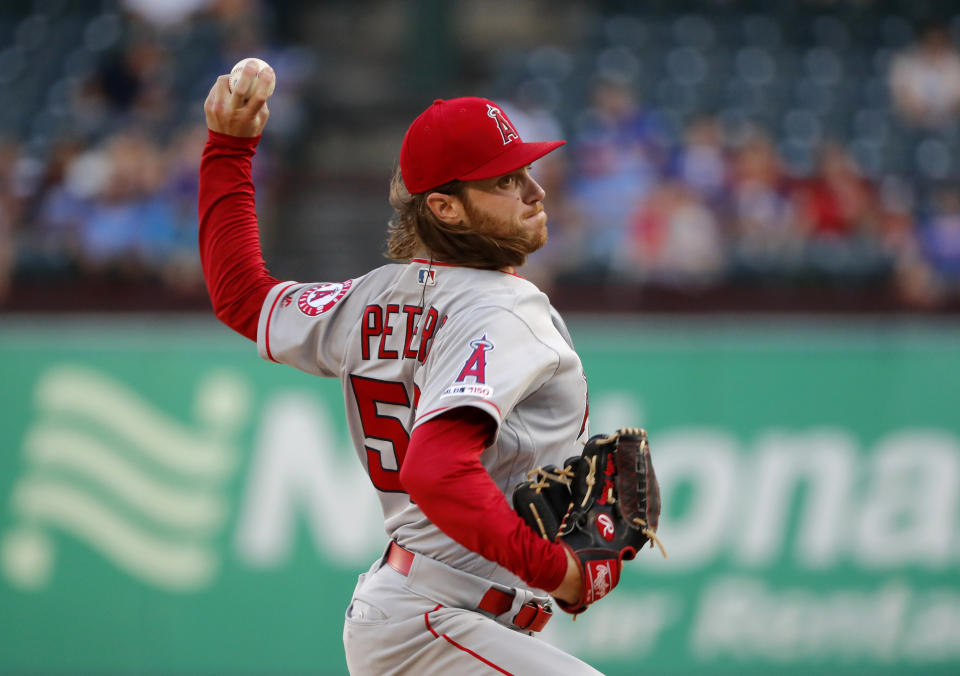 Los Angeles Angels starting pitcher Dillon Peters throws to the Texas Rangers in the first inning of baseball game in Arlington, Texas, Monday, Aug. 19, 2019. (AP Photo/Tony Gutierrez)