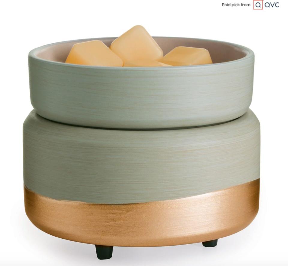 The gilded base on this candle warmer makes it look much more modern than your run-of-the-mill wax melter. It can melt candles and warm up wax melts to give you the scent of a candle without the flame. This set includes a warming base, warming dish and two wax melts. <a href="qvc.uikc.net/DYm2n" target="_blank" rel="noopener noreferrer">Find it for $20 at QVC</a>.