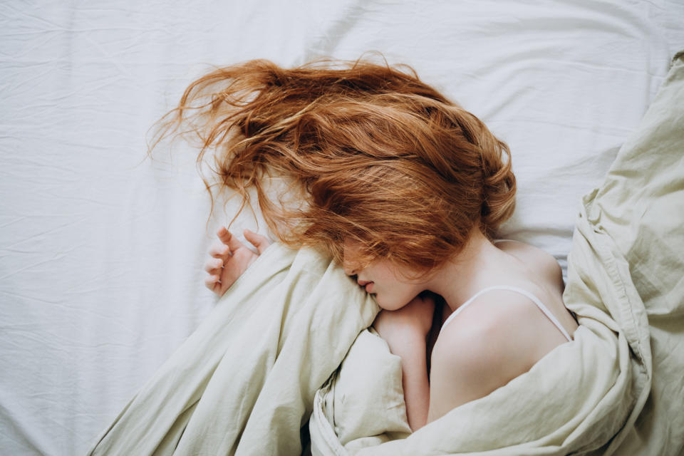 A red harried girl sleeping