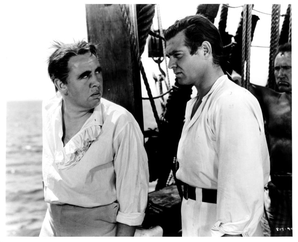 Charles Laughton, left, and Clark Gable standing on deck in "Mutiny on the Bounty" (1935)