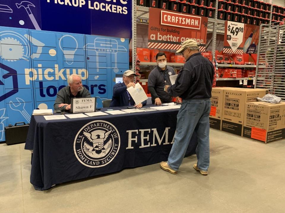 FEMA representatives meet with residents at Lowe's in Houma.