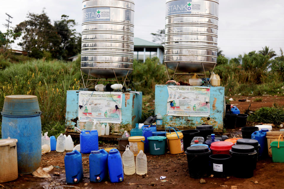 Containers are lined up beside a water tank at an evacuation camp in Marawi City, Lanao del Sur province, Philippines. (Photo: Eloisa Lopez/Reuters)