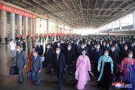 Delegates arrive for the celebrations for the 75th founding anniversary of the WPK at Pyongyang railway station