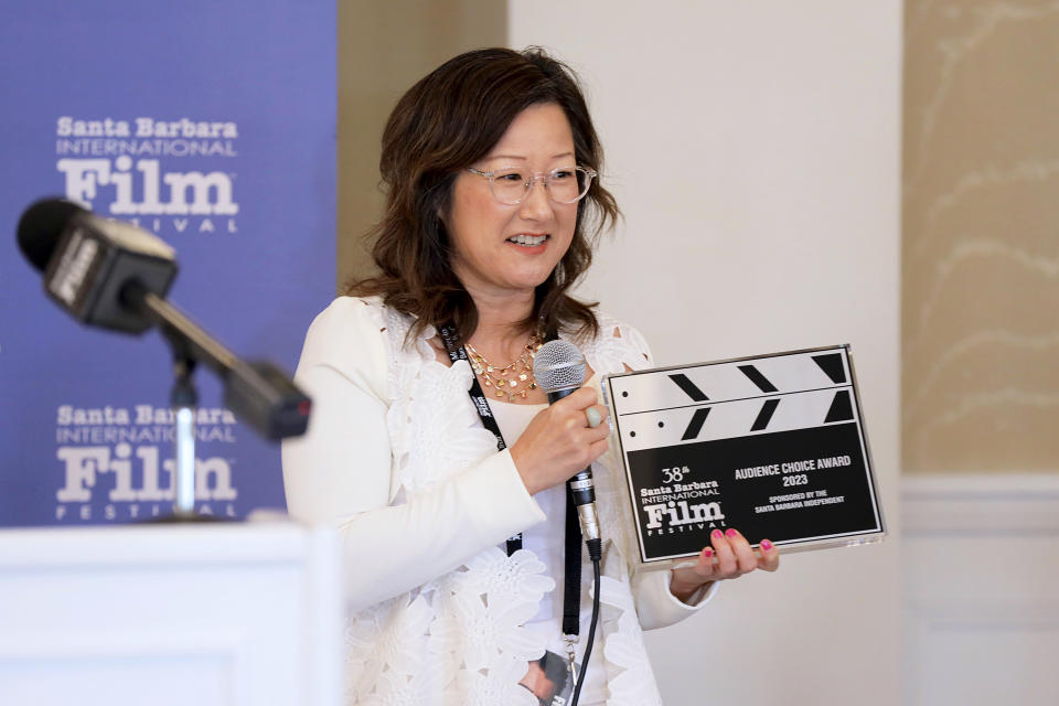 Christine Yoo accepts the Audience Choice Award for '26.2 To Life' at the Awards Breakfast during the 38th Annual Santa Barbara International Film Festival at El Encanto on February 18, 2023 in Santa Barbara, California.