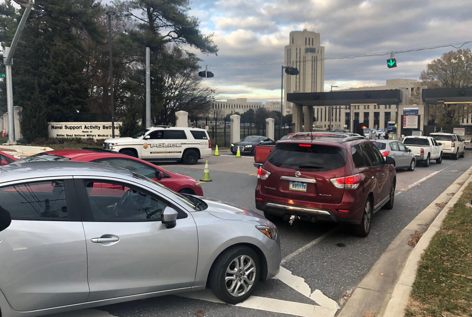 Cars are prevented from entering or exiting the Walter Reed National Military Medical Center, Tuesday, Nov. 27, 2018 in Bethesda, Md. Security officers found "no indication" of an active shooter after reports from Walter Reed National Military Medical Center outside Washington, officials said Tuesday.Naval Support Activity Bethesda tweeted at 2:15 p.m. that an active shooter had been reported in the basement of a building at the Maryland base. (AP Photo/Michael Kunzelman)