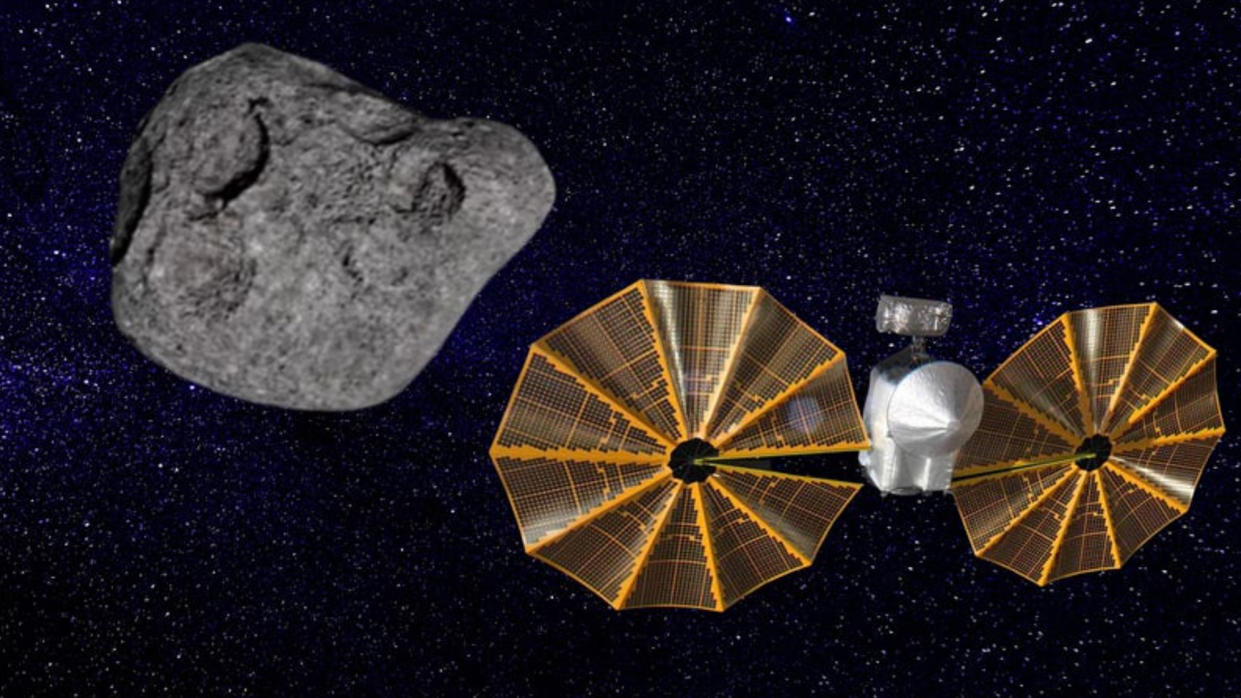  An illustration of NASA's Lucy spacecraft as it approaches the asteroid Dinkinesh. 