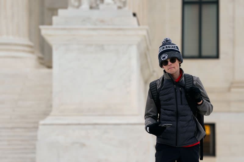 Blake Fox, of Washington, listens to a live broadcast of the U.S. Supreme Court arguments in Carson v. Makin, in Washington