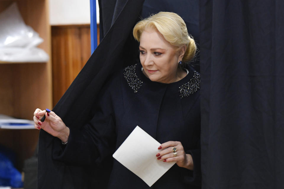 Former Prime Minister and presidential candidate for the Social Democratic party Viorica Dancila exits a voting cabin in Bucharest, Romania, Sunday, Nov. 24, 2019. Romanians are voting in a presidential runoff election in which incumbent Klaus Iohannis is vying for a second term, facing Social Democratic Party leader Viorica Dancila, a former prime minister, in Sunday's vote. (AP Photo/Andreea Alexandru)