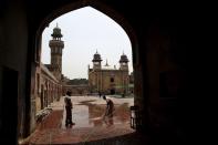 <p>Workers wash the courtyard of a mosque in preparation for Ramadan in Lahore, Pakistan, May 27, 2017. (AP Photo/K.M. Chaudary) </p>