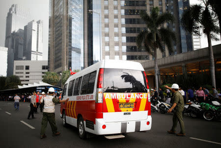 An ambulance arrives at the Indonesian Stock Exchange building following reports of a collapsed structure inside the building in Jakarta, Indonesia January 15, 2018. REUTERS/Darren Whiteside