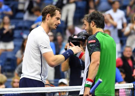 Sept 3, 2016; New York, NY, USA; Andy Murray of Great Britain shakes hands with Paolo Lorenzi of Italy after their match on day six of the 2016 U.S. Open tennis tournament at USTA Billie Jean King National Tennis Center. Mandatory Credit: Robert Deutsch-USA TODAY Sports