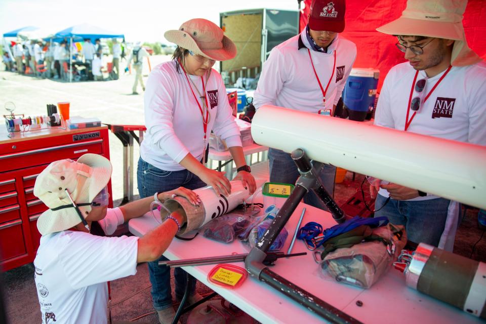 The Atomic Aggies work on their rocket during the Spaceport America Cup on Friday, June 21, 2023, at Spaceport America. 
