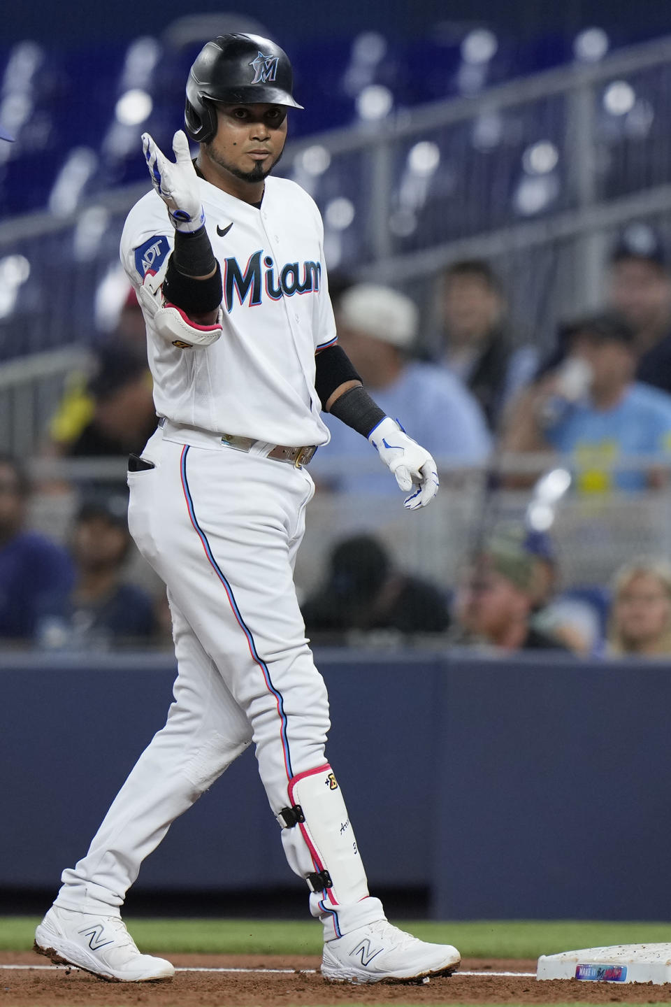 Miami Marlins' Luis Arraez celebrates a base hit during the first inning of a baseball game against the Tampa Bay Rays, Tuesday, Aug. 29, 2023, in Miami. (AP Photo/Wilfredo Lee)