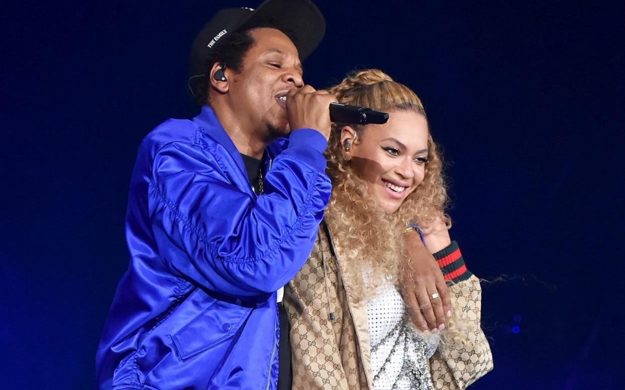 Jay-Z and Beyonce Knowles perform on stage during their