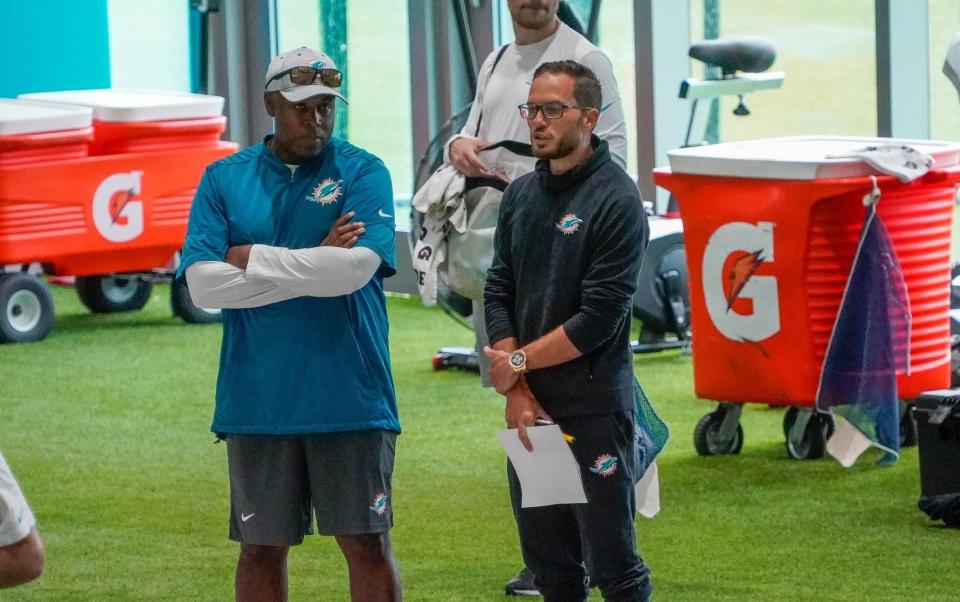 Miami Dolphins general manager Chris Grier and head coach Mike McDaniel watch training camp at Baptist Health Training Complex, Friday, July 28, 2023 in Miami Gardens.