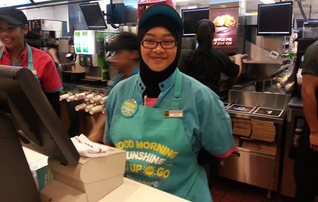 One of the cheerful staff to greet morning customers.