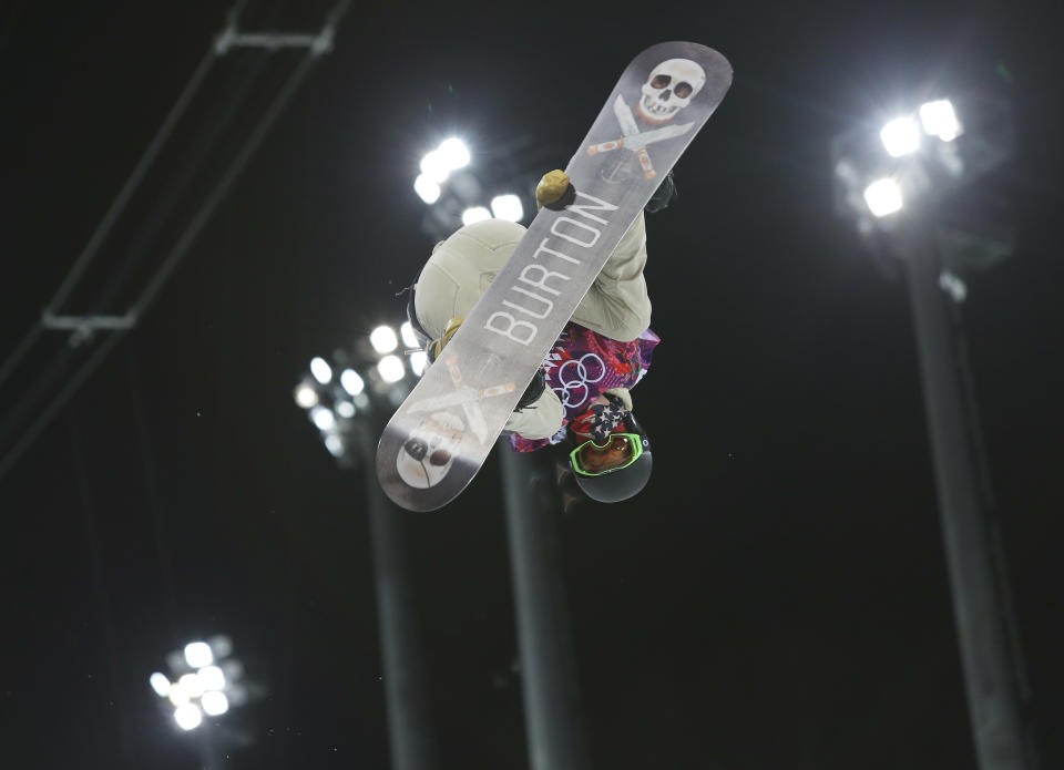 Shaun White of the United States gets air during a snowboard half pipe training session at the Rosa Khutor Extreme Park at the 2014 Winter Olympics, Monday, Feb. 10, 2014, in Krasnaya Polyana, Russia. (AP Photo/Sergei Grits)