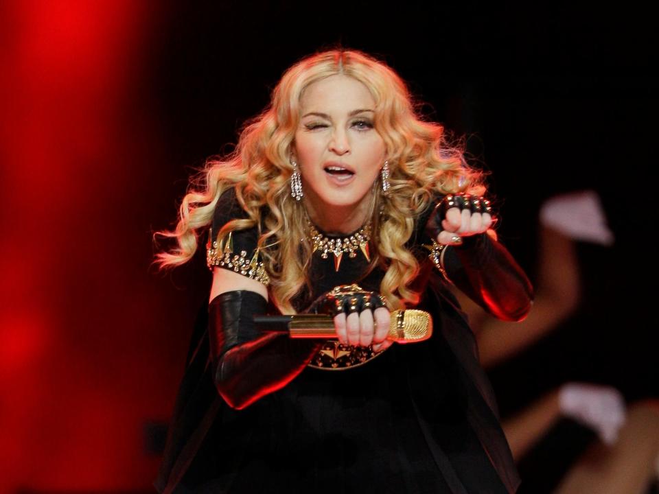 Madonna performs at the Super Bowl Halftime Show in 2012