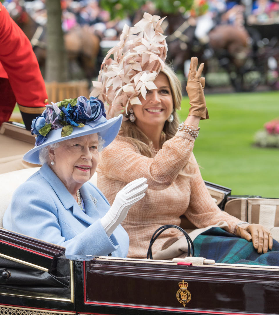 ASCOT, ENGLAND - JUNE 18: Queen Elizabeth II and Queen Maxima of the Netherlands arrive by carriage on day one of Royal Ascot at Ascot Racecourse on June 18, 2019 in Ascot, England. (Photo by Samir Hussein/WireImage)