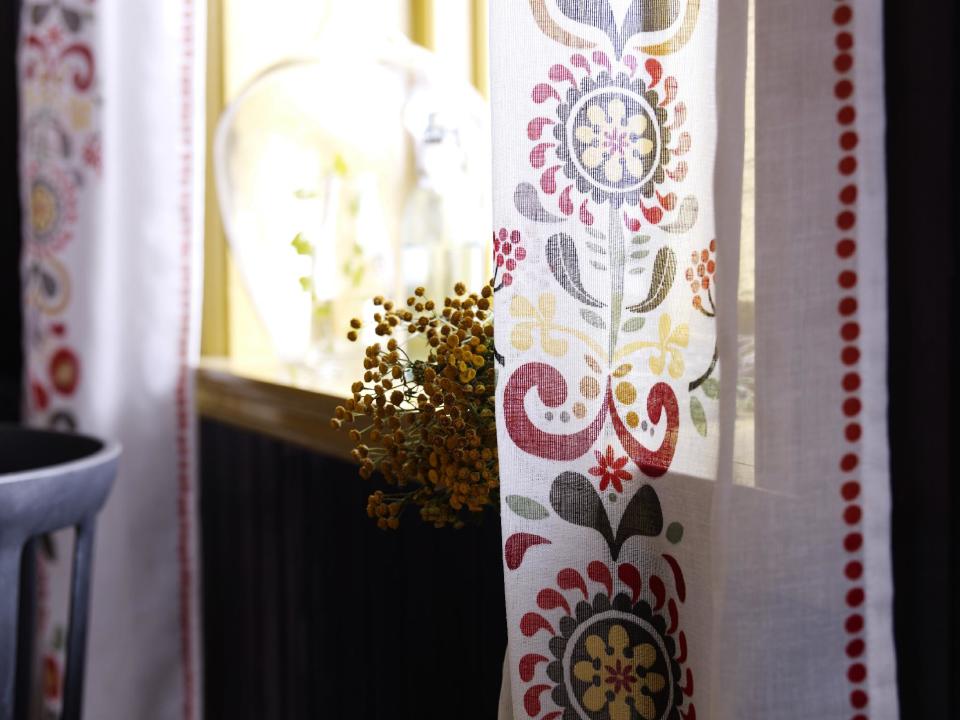 In this publicity product photo provided by Ikea (www.ikea.com), Eva Lundgreen’s Akerkulla design on a curtain is a pretty way to introduce Swedish influence in room décor. (AP Photo/Ikea)